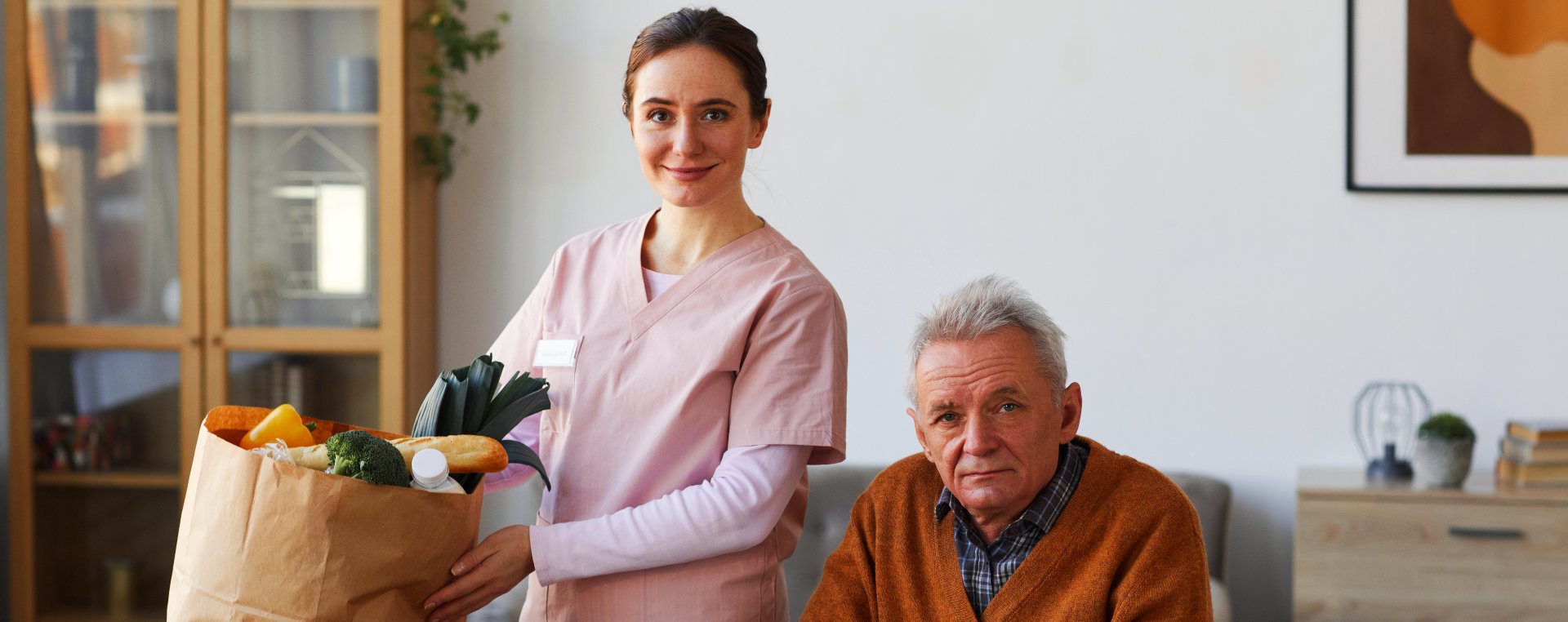 image of a female caregiver and an elderly man